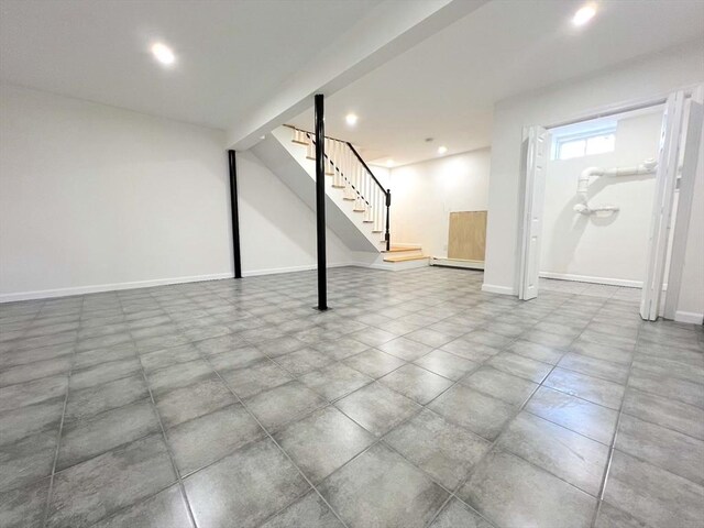 8 William Unit 8, Haverhill, MA 01830 - below grade area featuring recessed lighting, baseboards, baseboard heating, and stairs