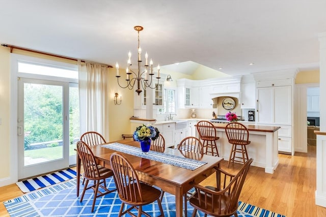 86 Champlain, Chatham, MA 02633 - dining area featuring a chandelier, healthy amount of natural light, light wood-style flooring, and lofted ceiling