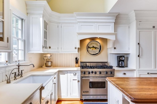 86 Champlain, Chatham, MA 02633 - kitchen with designer range, white cabinetry, and light countertops