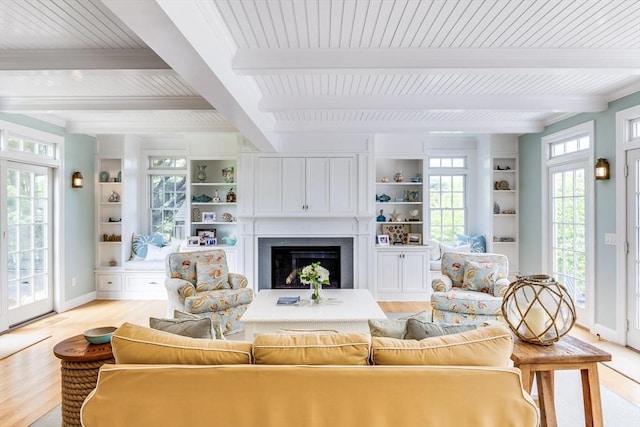 86 Champlain, Chatham, MA 02633 - living room featuring beam ceiling, light wood finished floors, a fireplace, and crown molding