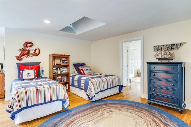 86 Champlain, Chatham, MA 02633 - bedroom featuring light wood-style floors, a skylight, and recessed lighting