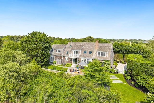 86 Champlain, Chatham, MA 02633 - rear view of property with a chimney, a patio area, a gambrel roof, entry steps, and a yard