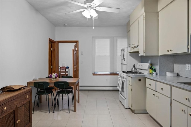 25 Sheafe St, Boston, MA 02113 - kitchen featuring white appliances, under cabinet range hood, a baseboard heating unit, ceiling fan, and light countertops