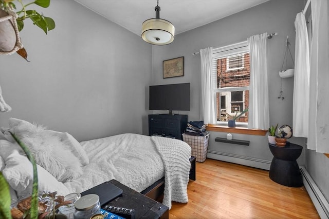 25 Sheafe St, Boston, MA 02113 - bedroom featuring a baseboard radiator and wood finished floors