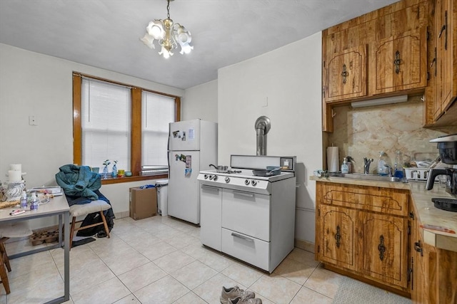 25 Sheafe St, Boston, MA 02113 - kitchen featuring white appliances, a sink, light countertops, and brown cabinetry