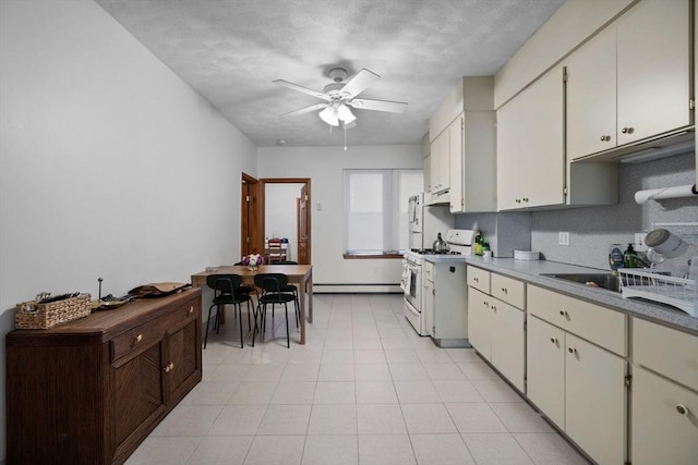 25 Sheafe St, Boston, MA 02113 - kitchen with white gas range, a baseboard radiator, a ceiling fan, and baseboards