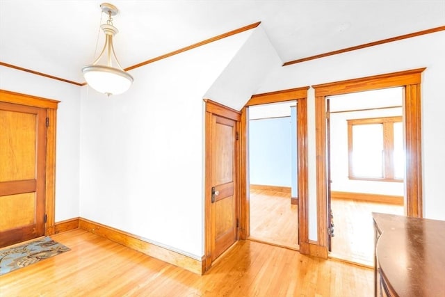 17 Matchett St, Boston, MA 02135 - unfurnished dining area featuring light wood finished floors, baseboards, and ornamental molding