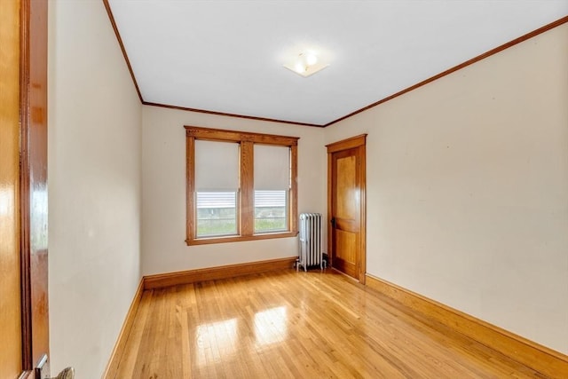 17 Matchett St, Boston, MA 02135 - unfurnished room featuring radiator, crown molding, light wood-style flooring, and baseboards