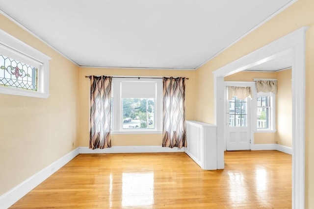 17 Matchett St, Boston, MA 02135 - unfurnished room with light wood-style floors, crown molding, and baseboards