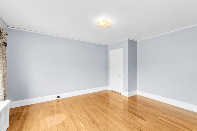 17 Matchett St, Boston, MA 02135 - unfurnished room featuring baseboards, light wood-style floors, and ornamental molding