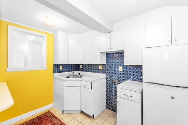 17 Matchett St, Boston, MA 02135 - washroom with a textured ceiling, light tile patterned flooring, a sink, and baseboards