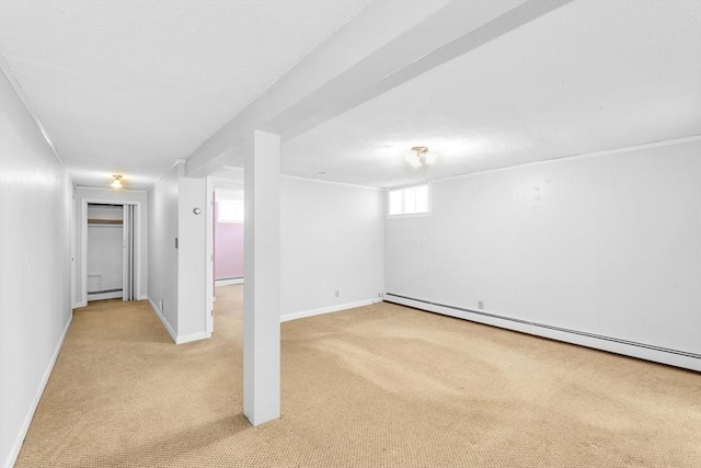 17 Matchett St, Boston, MA 02135 - basement with light carpet, baseboard heating, baseboards, and a baseboard heating unit