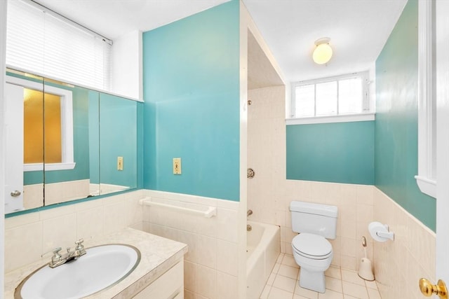 17 Matchett St, Boston, MA 02135 - bathroom with tile walls, toilet, vanity, wainscoting, and tile patterned floors