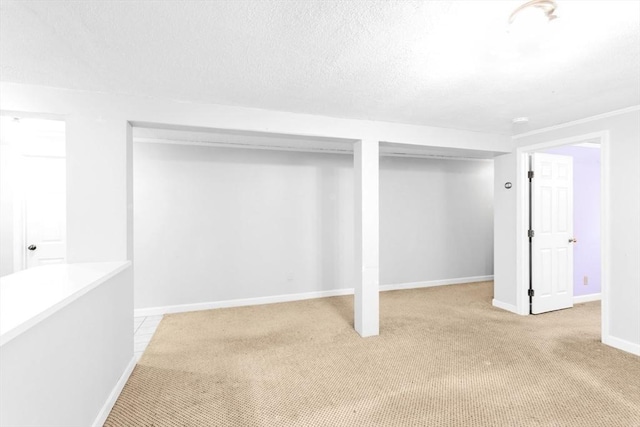 17 Matchett St, Boston, MA 02135 - finished basement with light carpet, baseboards, and a textured ceiling