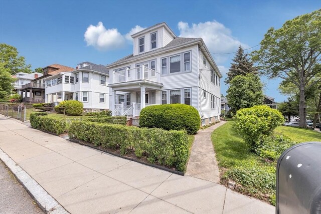 17 Matchett St, Boston, MA 02135 - traditional style home featuring a balcony, a front yard, and a residential view