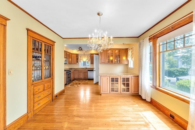 17 Matchett St, Boston, MA 02135 - kitchen with stainless steel appliances, light wood-style floors, a chandelier, healthy amount of natural light, and crown molding