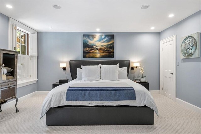 carpeted bedroom with recessed lighting and baseboards