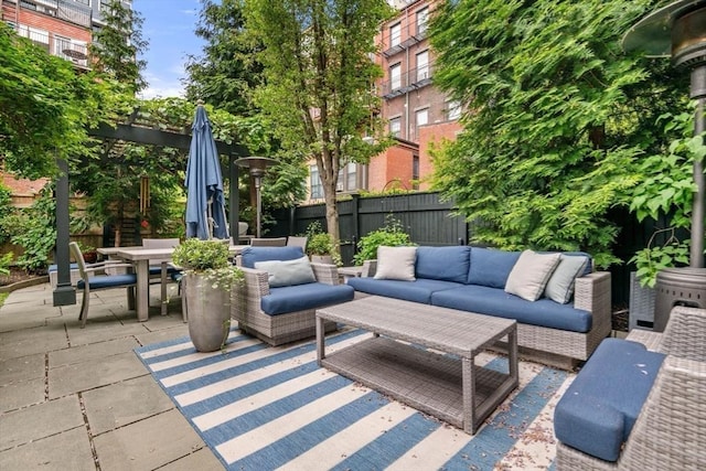 view of patio / terrace with an outdoor hangout area, a fenced backyard, and outdoor dining space