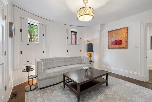 living room with wood finished floors and baseboards
