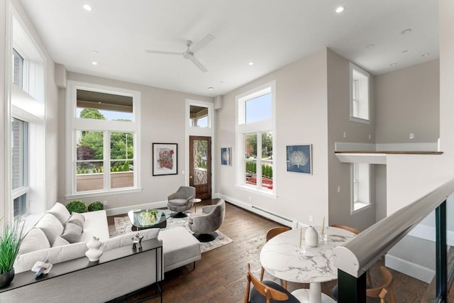 living room with dark hardwood / wood-style flooring and ceiling fan