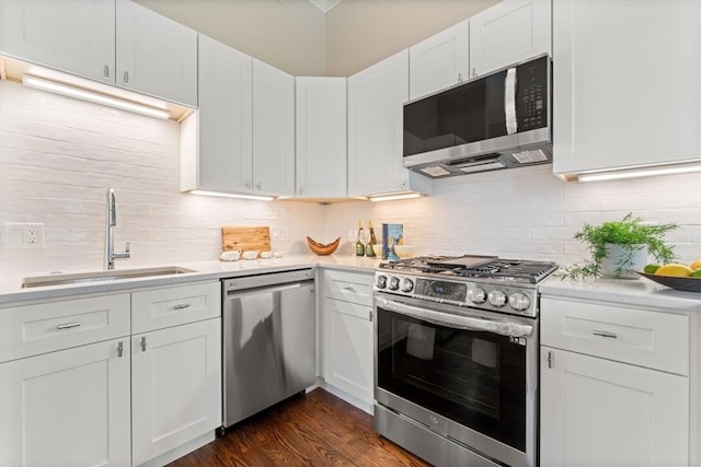 kitchen featuring white cabinetry, sink, and appliances with stainless steel finishes