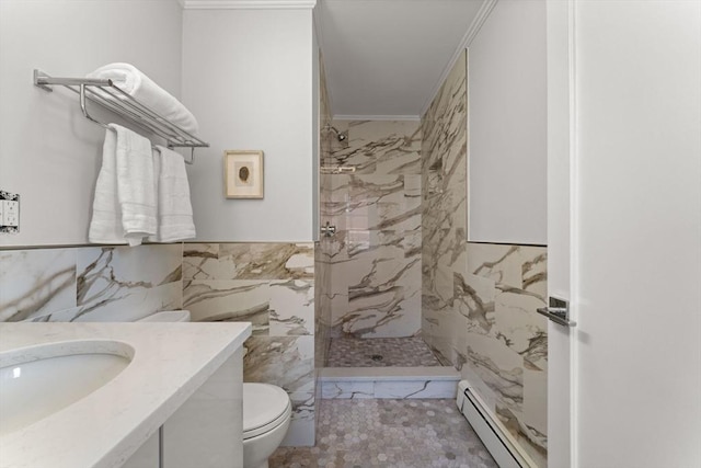 bathroom with crown molding, toilet, baseboard heating, tile walls, and a tile shower