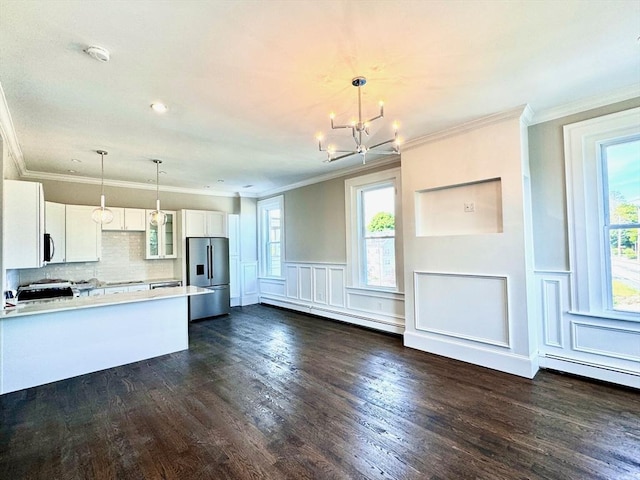 kitchen featuring stainless steel fridge, dark hardwood / wood-style flooring, a baseboard radiator, and white cabinetry