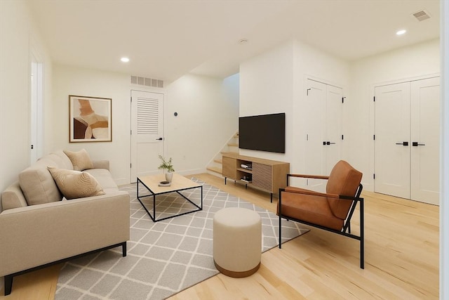 59 Dartmouth St Unit B, Somerville, MA 02145 - living room featuring light wood-style floors, recessed lighting, stairs, and baseboards