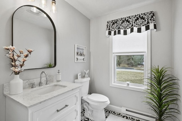 half bath featuring vanity, toilet, baseboards, and a baseboard radiator