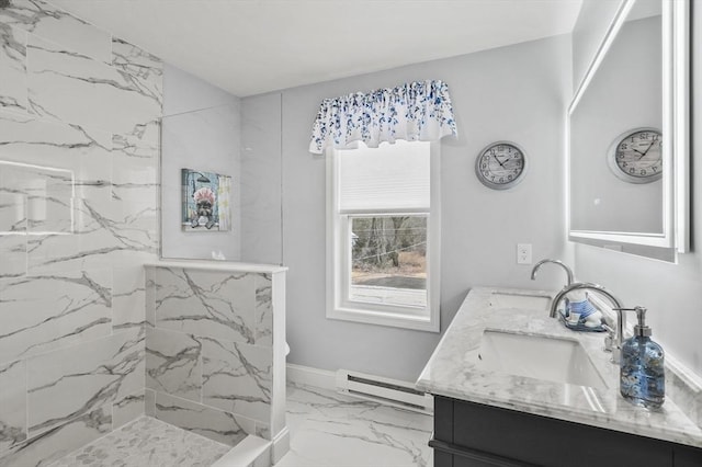 full bathroom with a sink, baseboard heating, marble finish floor, and double vanity