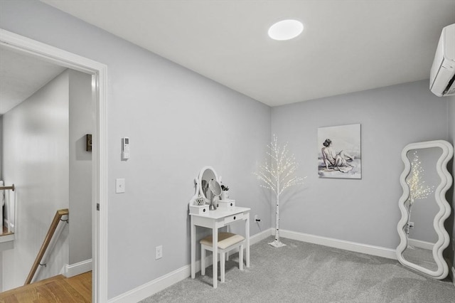 home office with baseboards, carpet, and a wall unit AC