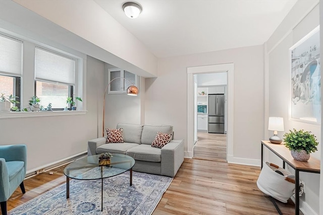 1992 Commonwealth Ave Unit B, Boston, MA 02135 - living area with light wood-style floors and baseboards