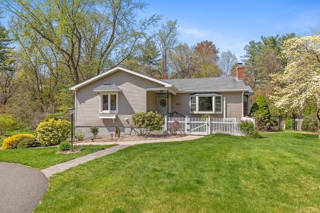 ranch-style house with a gate, a chimney, fence private yard, and a front yard