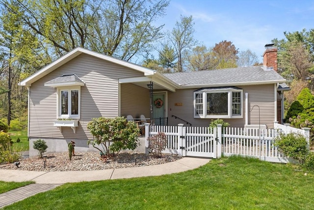 ranch-style home featuring a front lawn, roof with shingles, a chimney, a gate, and a fenced front yard