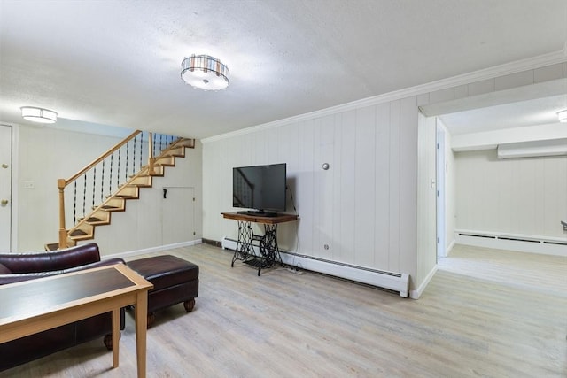 living area featuring a baseboard heating unit, stairs, wood finished floors, and ornamental molding