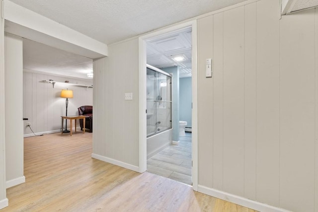interior space featuring baseboards and light wood-type flooring