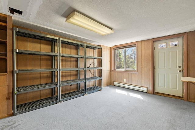 storage room featuring a baseboard heating unit