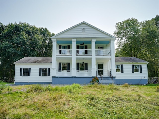 view of front facade featuring a balcony and a porch