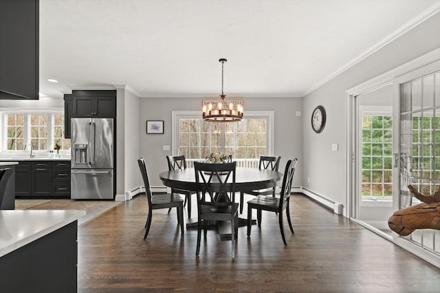 65 Stonegate Dr, East Bridgewater, MA 02333 - dining space featuring a baseboard heating unit, a chandelier, and a wealth of natural light