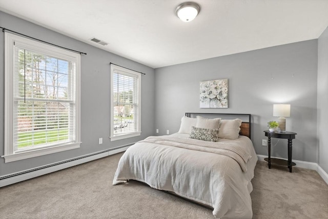 65 Stonegate Dr, East Bridgewater, MA 02333 - carpeted bedroom with visible vents, baseboards, and a baseboard heating unit