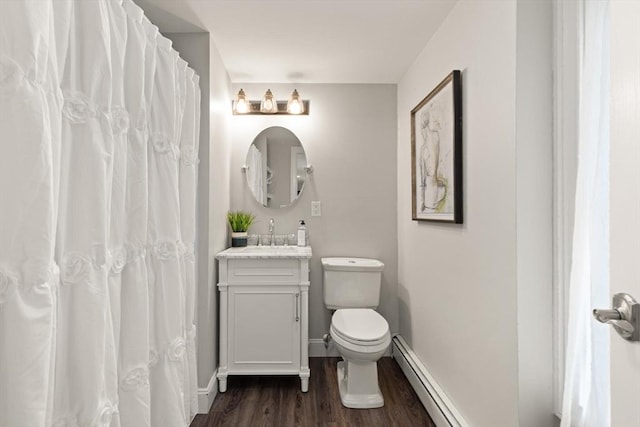65 Stonegate Dr, East Bridgewater, MA 02333 - full bath with baseboard heating, vanity, toilet, baseboards, and wood finished floors