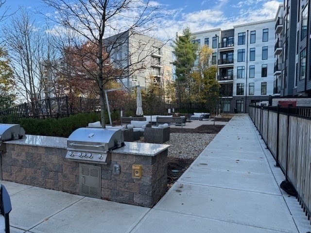 view of patio / terrace featuring area for grilling and a grill