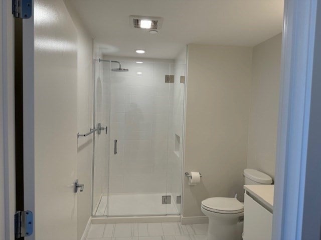 bathroom with vanity, walk in shower, and toilet