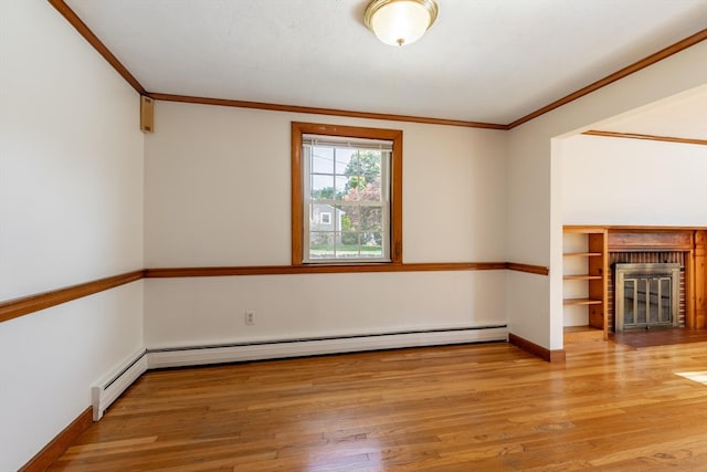 unfurnished living room with ornamental molding, a fireplace, and light hardwood / wood-style flooring