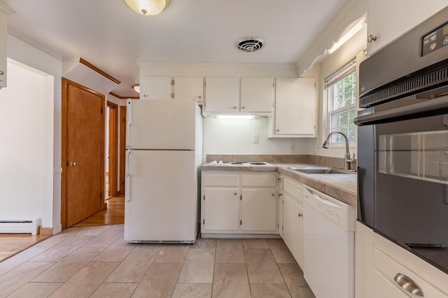 kitchen with white cabinets, light hardwood / wood-style flooring, sink, and white appliances