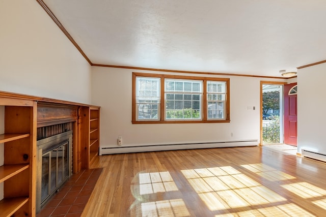 unfurnished living room with crown molding, plenty of natural light, dark wood-type flooring, and a baseboard heating unit