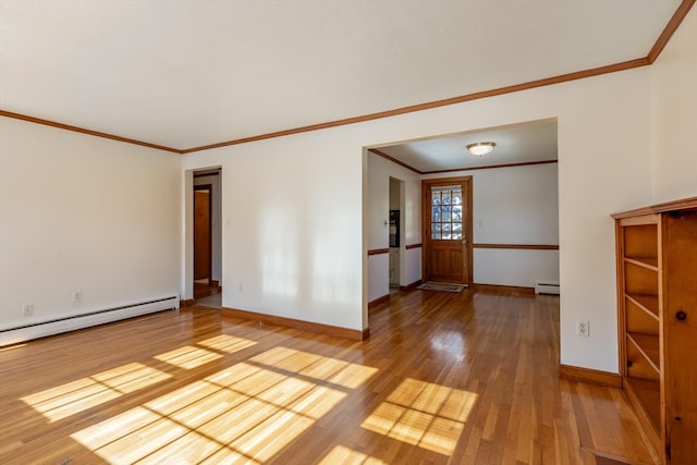 spare room with light wood-type flooring, crown molding, and a baseboard radiator