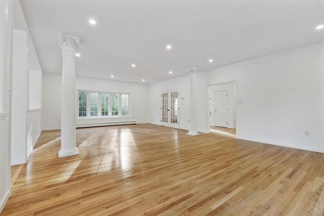 unfurnished living room featuring light wood finished floors, a baseboard radiator, decorative columns, and recessed lighting