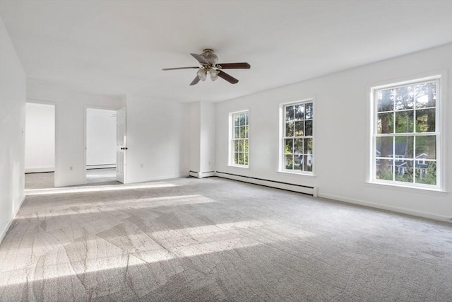 carpeted empty room with a baseboard heating unit, baseboards, a baseboard radiator, and ceiling fan