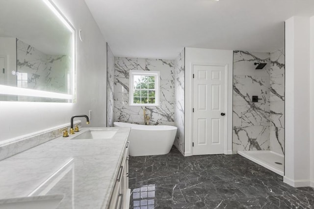 bathroom featuring vanity, a marble finish shower, marble finish floor, and a freestanding tub